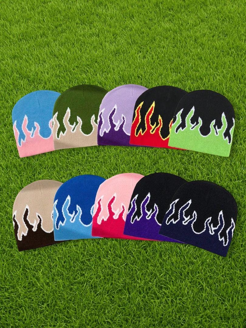 Flame pattern jacquard knit beanies in ten colorways on green turf