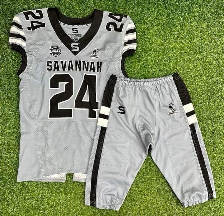 Light gray football jersey with black side-stripe pants