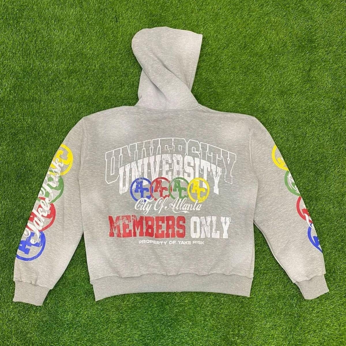 Heather grey zip hoodie with multicolor collegiate front and back graphics detail 1