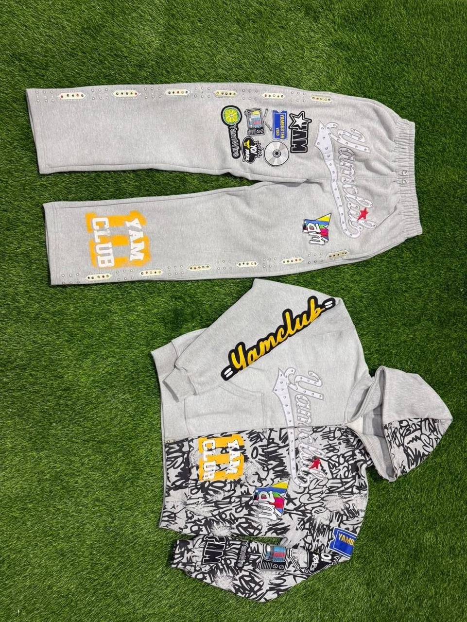 Custom graphic zip hoodie and sweatpants with patches across colorways detail 1